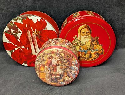 3 Vintage Christmas Themed Round Tins. This lot includes: 
(1) Santa With Kids Tin. This is 