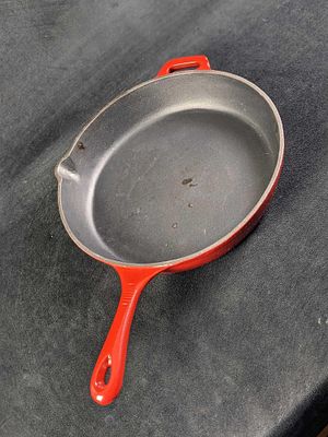 Red Enameled 12" Cast Iron Skillet. Company is unknown. Is marked DENMARK and CHINA. Is approx 