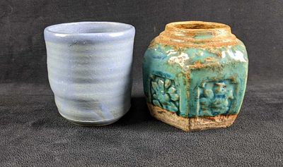 Primitive Earthenware Pottery This lot has two small primitive vases. These art pieces are in 