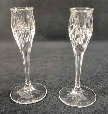 Two Clear Crystal Candlesticks. The company and date of creation are unknown. Candlesticks are 