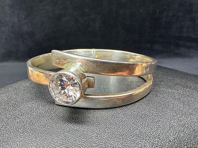 Sterling CZ Hinged Bangle. This piece of jewelry has been tested and researched prior to 