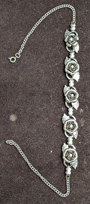 Vintage Silver Tone Rhinestone Roses Bracelet. This is 15 1/2" and it weighs 0.06lb. The maker 