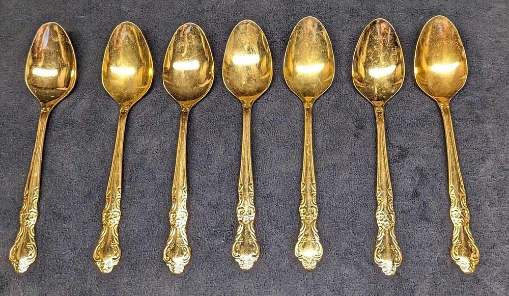 7 Cambridge Gold Electroplated Stainless Oval Soup Spoons. Each is approx 1 1/2" x 1/2" x 7 