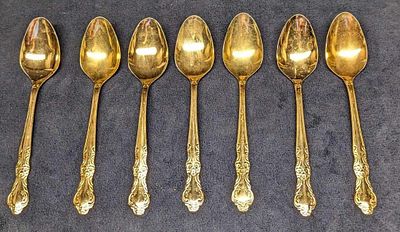 7 Cambridge Gold Electroplated Stainless Oval Soup Spoons. Each is approx 1 1/2" x 1/2" x 7 