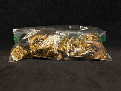 7.2 OZ A Pirates Trinket Bag Gold Charms Beads Buttons and More. This lot contains loose and/or 