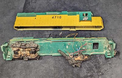 Weaver GP 38-2 Diese Locomotive Parts. This locomotive apparently went off the tracks and can 
