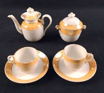 Vintage Lusterware Minature Porcelain Tea Set. This lot includes: (6) Saucers. These are approx 