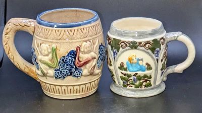 2 Vintage Ceramic Handpainted Mugs. This lot contains: 
(1) Ceramic 3D Grapevines Scenes Mug. 