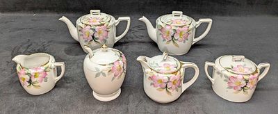 Retired Noritake Azelea Floral Pattern Tea Set. This lot includes: 
(2) Teapot With Lid. Each is 