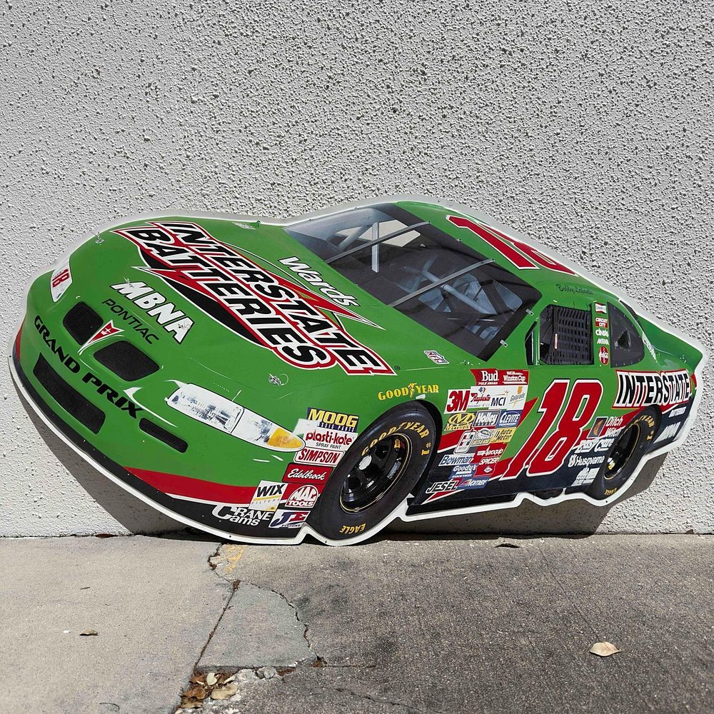 Lot 189: Interstate Batteries NASCAR #18 Bobby Labonte Embossed Metal Tin Sign 50" x 25"