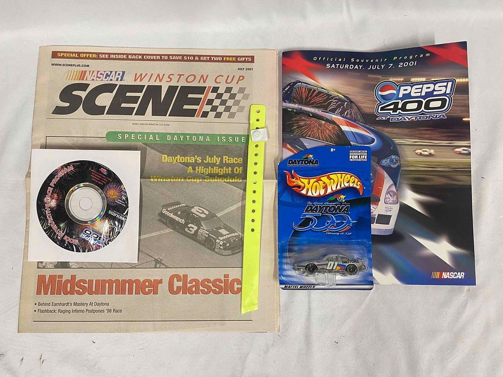 Lot 196: Official 2001 Daytona 500 Pepsi 400 Program - CD - Hotwheels - Scene Newspaper - Armband