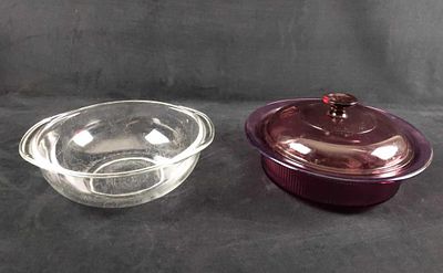 Two Pyrex And Vision Glass Cookware. This lot includes: (1) Clear Pyrex Glass Bowl With Handles. 