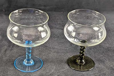 Two Black And Blue Swirl Stem Sherbet Glasses. Each is approx 4" x 4" x 4 1/2" and together they 