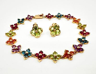 14k Gold Multi-Stone Bracelet & Earrings. This piece of jewelry has been tested and researched 