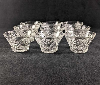 Nine Clear Glass Teacups Starburst Design Teacups This is a set of nine pressed glass teacups 