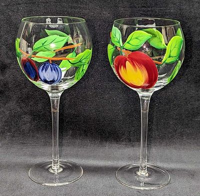 2 Tall Stem Hand Painted Fruit Wine Glasses. Its maker and date of creation are unknown. Each 