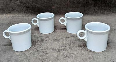 4 Fiesta Periwinkle Blue Mugs B. Each is approx 5" x 3 1/2" x 3 3/8" and the total weight is 
