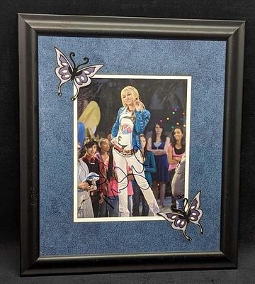 Autographed Miley Cyrus Hannah Montana Framed Photo. The framed photo is approximately 15 3/8" 