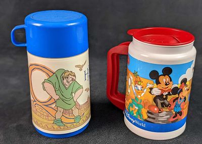 Disney Park Mug Hunchback Of Notre Dame Aladdin Thermos Style. This lot consists of: (1) Aladdin 