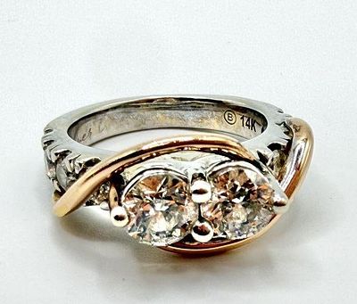 14k Gold Two Tone Ring With Twin Diamonds. This piece of jewelry has been tested and researched 