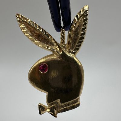 Michael Anthony 14k Yellow Gold Playboy Bunny Ruby Pendant. This item is in good pre-owned 