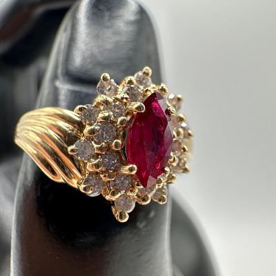 14K Gold Marquise Cut Lab Ruby and Halo Style of Accent Diamonds Ring. This item is in good 