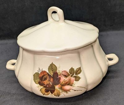 Vintage Ceramic Floral Pattern Serving Tureen With Spoon. The maker and date of creation is 