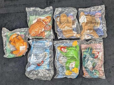 7 Burger King McDonalds Teenie Babies Armadillo. The lot includes: 
(1) Spunky The Cocker 