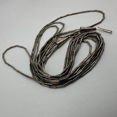 Liquid Silver Style Unmarked Four Strand Necklace X37. This item is in good pre-owned 