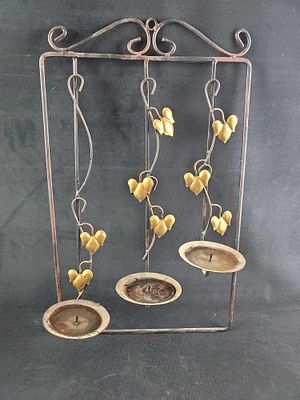 Metal 3 Tier Candle Wall Mount. Metal 3 candle wall mount. The candle mounts are staggard in 