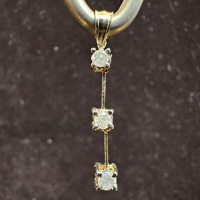 14K Triple Accent Diamond Dangle Gold Pendant. This item is in good pre-owned, previously 