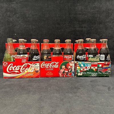 Coca Cola Commemorative 6 Pack Bottles with Carriers. Group of vintage Coca-Cola glass bottles 