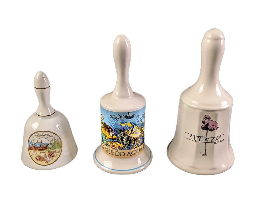 3 Vintage Porcelain Souvenir Bells Florida Key West Aquarium. This lot includes: 
(1) Key West 