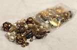 10 Plus Ounces of Gold Charms, Beads, Broken Costume Jewelry and More. This lot contains over 11 Image - 4
