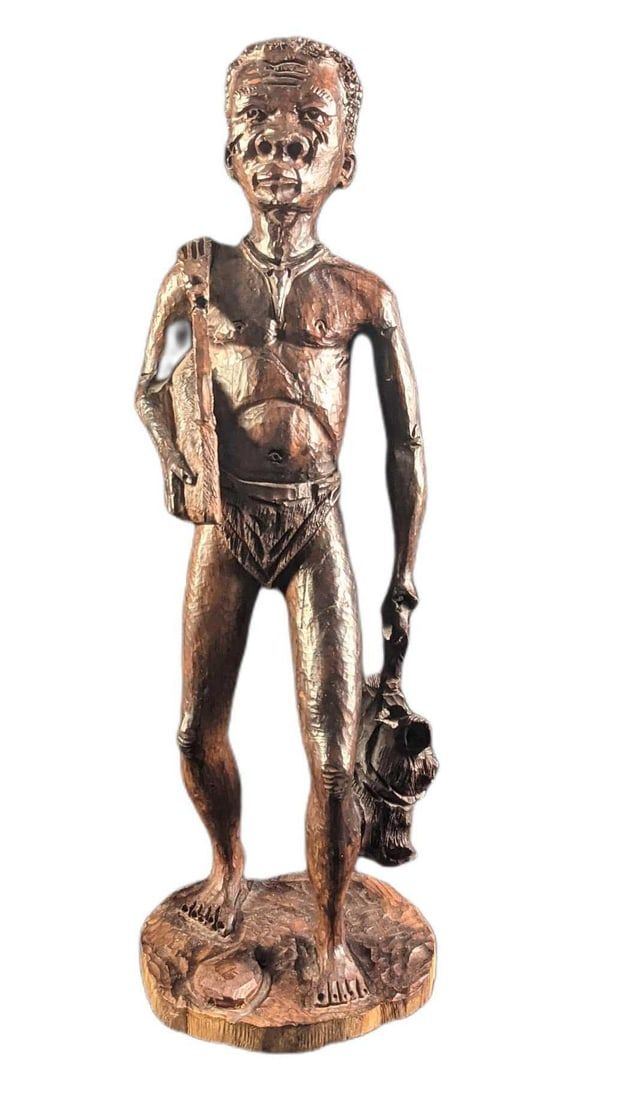 Large Hand Carved Wooden Tribal Hunter Statue. The maker and date of creation are unknown. Is 