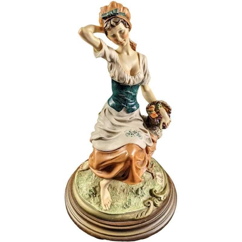 JB Giuseppe Armani Lady Figurine With Basket. Hand-painted Capodimonte porcelain of an woman in 
