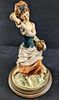 JB Giuseppe Armani Lady Figurine With Basket. Hand-painted Capodimonte porcelain of an woman in Image - 1
