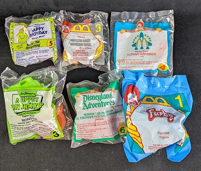 Sealed Happy Meal Toys Lot Of 6. This lot includes: 
(1) Inspector Gadget Watch Belt #3. From 