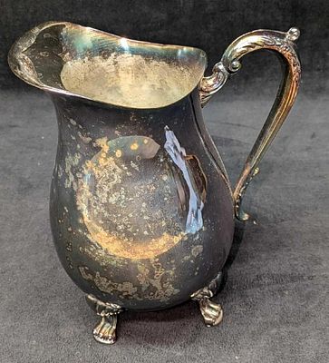 Vintage F.B. Rogers Silver Plated Footed Water Pitcher. This is approx 7 1/2" x 5 1/4" x 8 1/2" 