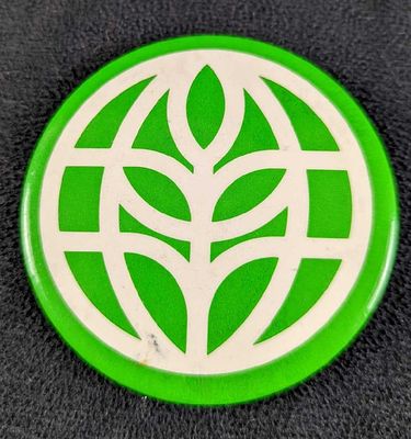 Vintage Disney EPCOT The Land Symbol 2 1/2" Button. From the early 1980s. Is approx 2 1/2" x 2 