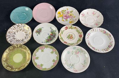Assorted Tea Saucers 11 China Saucers This lot consists of 11 saucers with assorted designs. 