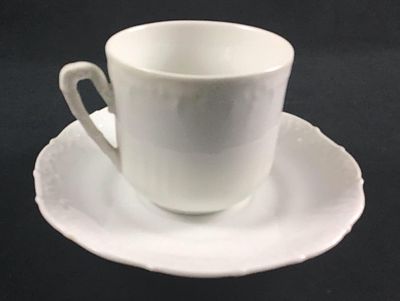 White Porcelain Tea Cup and Saucer. This lot consists of one tea cup and one matching saucer. 
