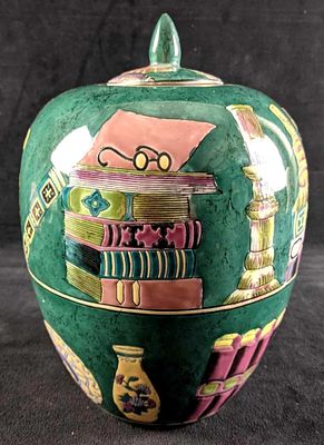 Large Green Lidded Vase This vase is in good condition with no known damage. The Vase shows a 