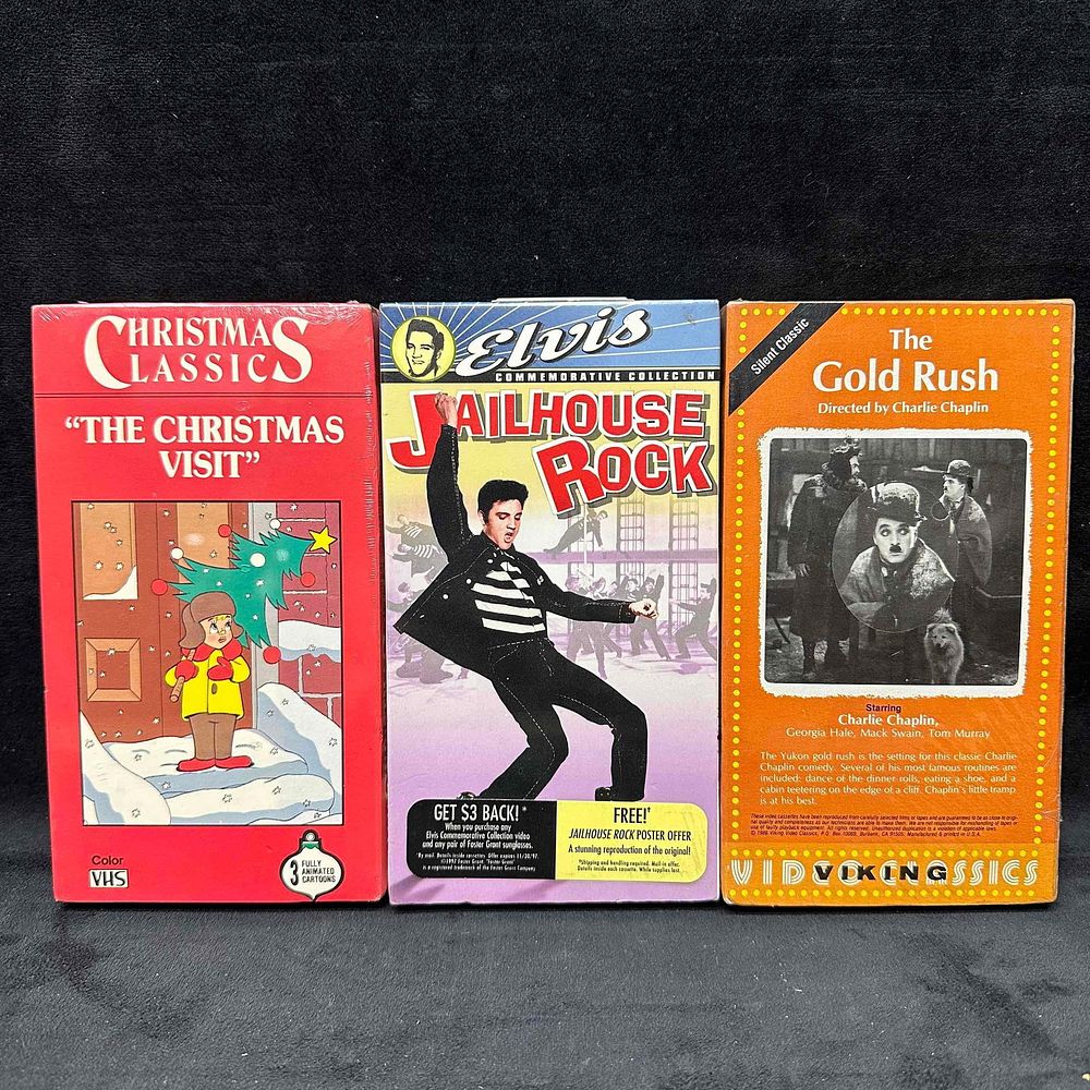 Lot 296: Lot of 3 VHS Movies The Christmas Visit Elvis Jailhouse Rock The Gold Rush Sealed