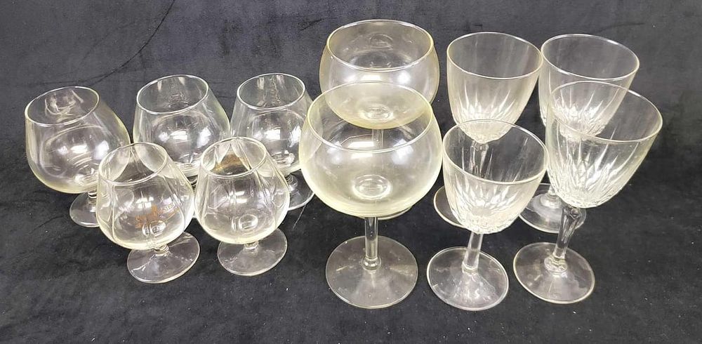 Lot 216: Set of 11 Stemmed Glasses