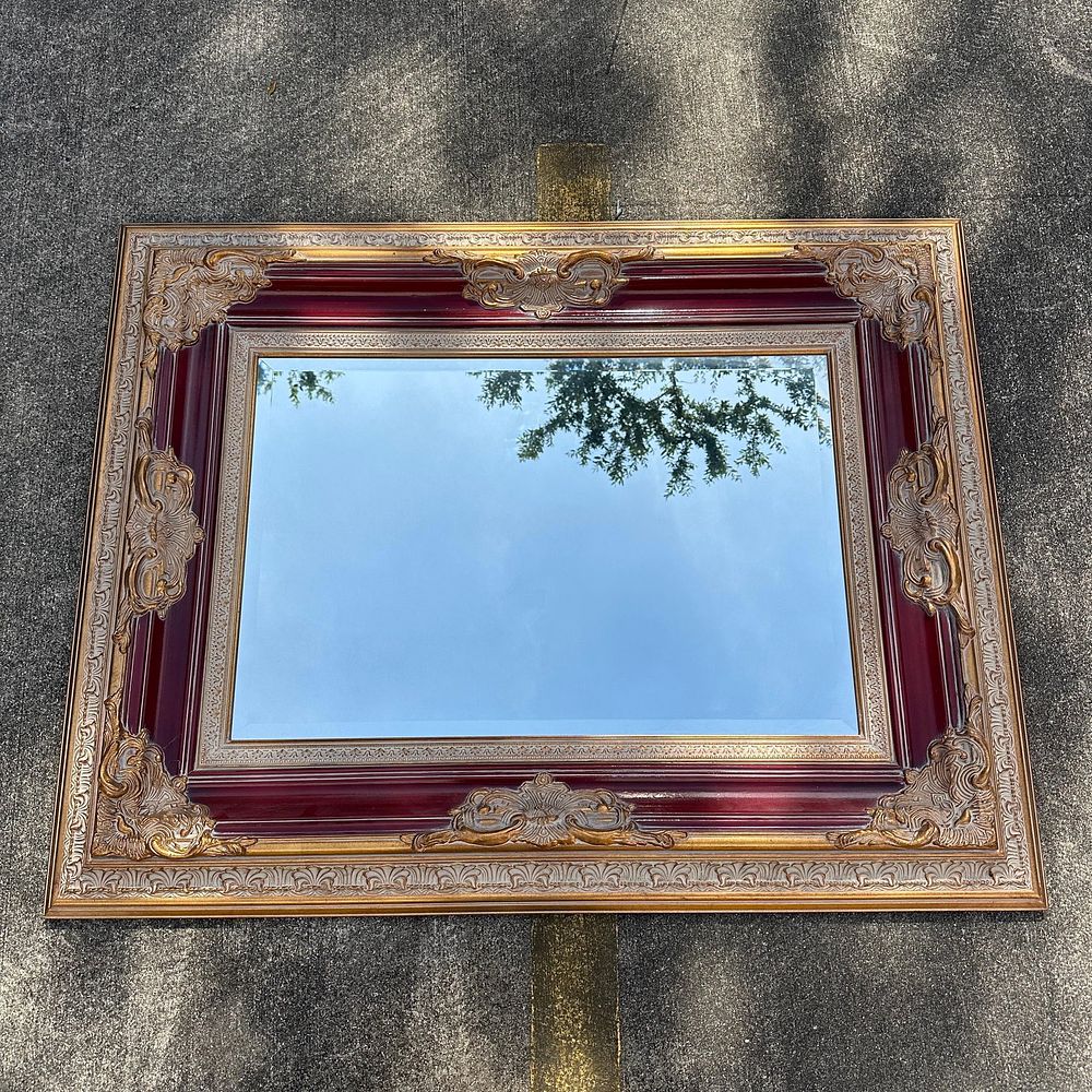 Lot 261: Monumental Ornate Beveled Wall Mirror in Gilt Gold and Burgundy Colored Frame
