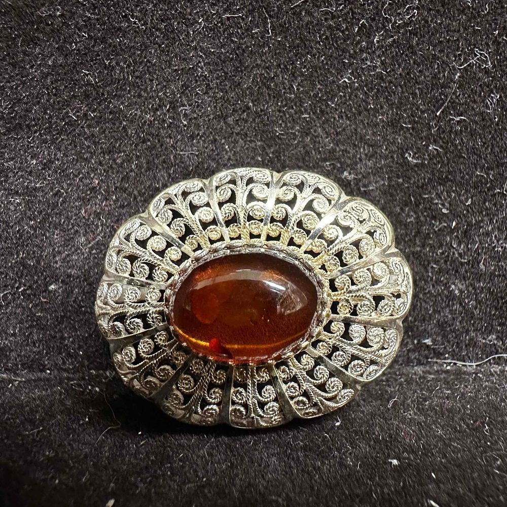 Lot 392: Ornate Filigree Metalwork Amber Cabochon Sterling Silver 935 Brooch