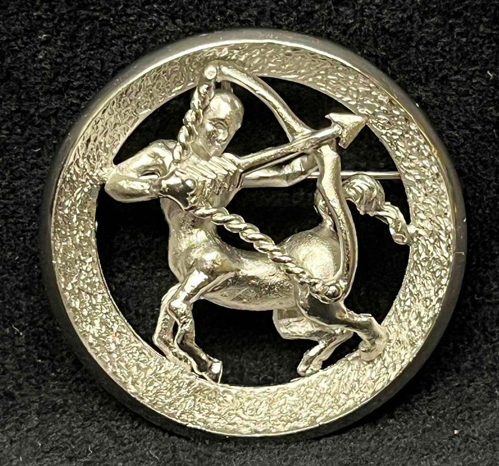 Lot 396: Vintage Signed Silver Tone Crown Trifari Sagittarius Zodiac Round Pin/Brooch