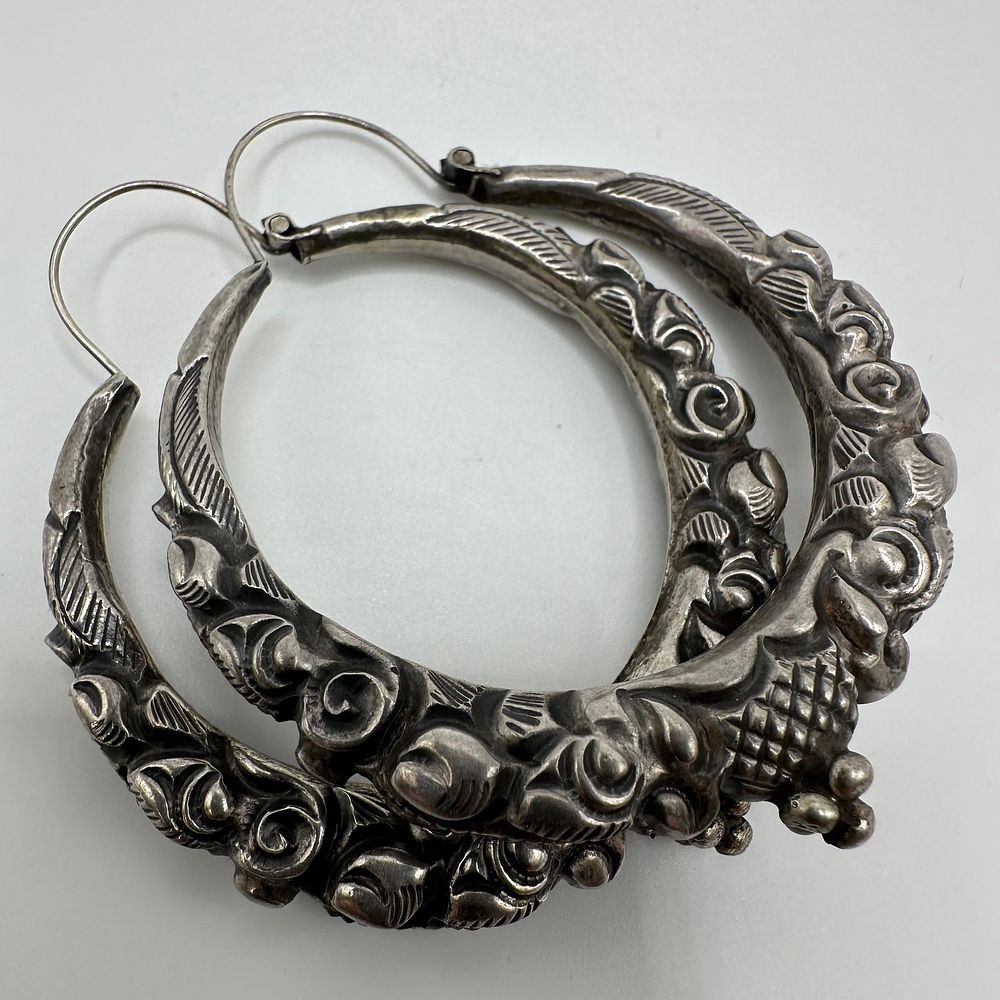 Lot 450: Ethnic Tribal Style Repousse and Floral Design Silver Large Hoop Earrings Q83