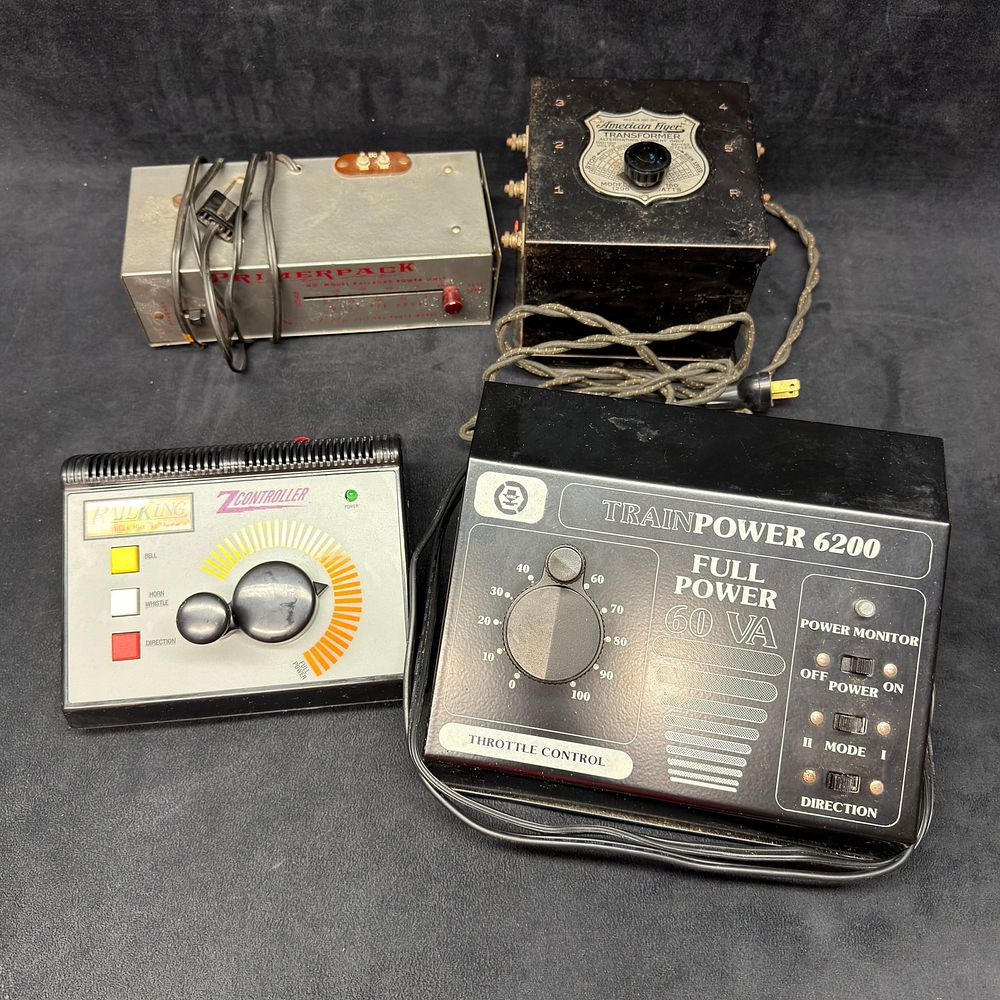 Lot 245: Group of Four Model Train Transformers and Controllers